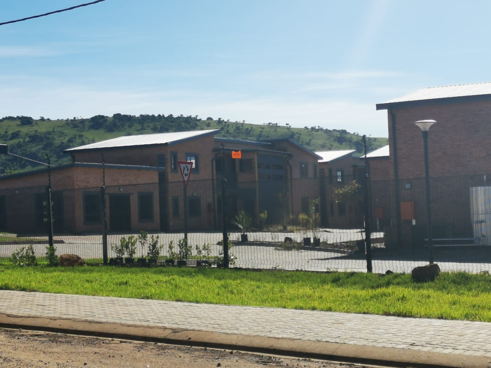 Street view of the Opal Students Apartments entrance and grounds